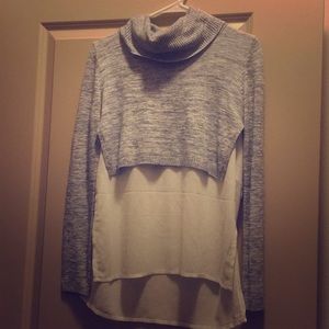 Turtle neck sweater with blouse layer